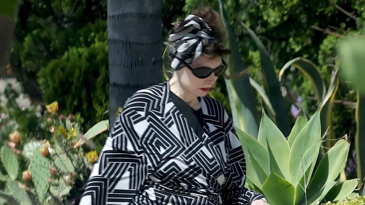 80s one-hit wonder looks unrecognizable on rare outing with duct-taped slippers... can you guess who it is?