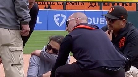 Tigers staff member makes shocking gesture at TV camera after collapsing on the field during MLB game