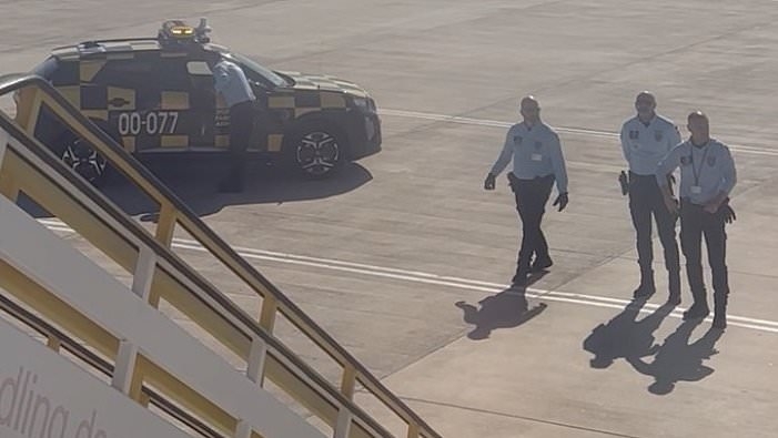 Rowdy British stag party force easyJet flight to divert before being marched off the plane after vaping in their seats and abusing cabin crew