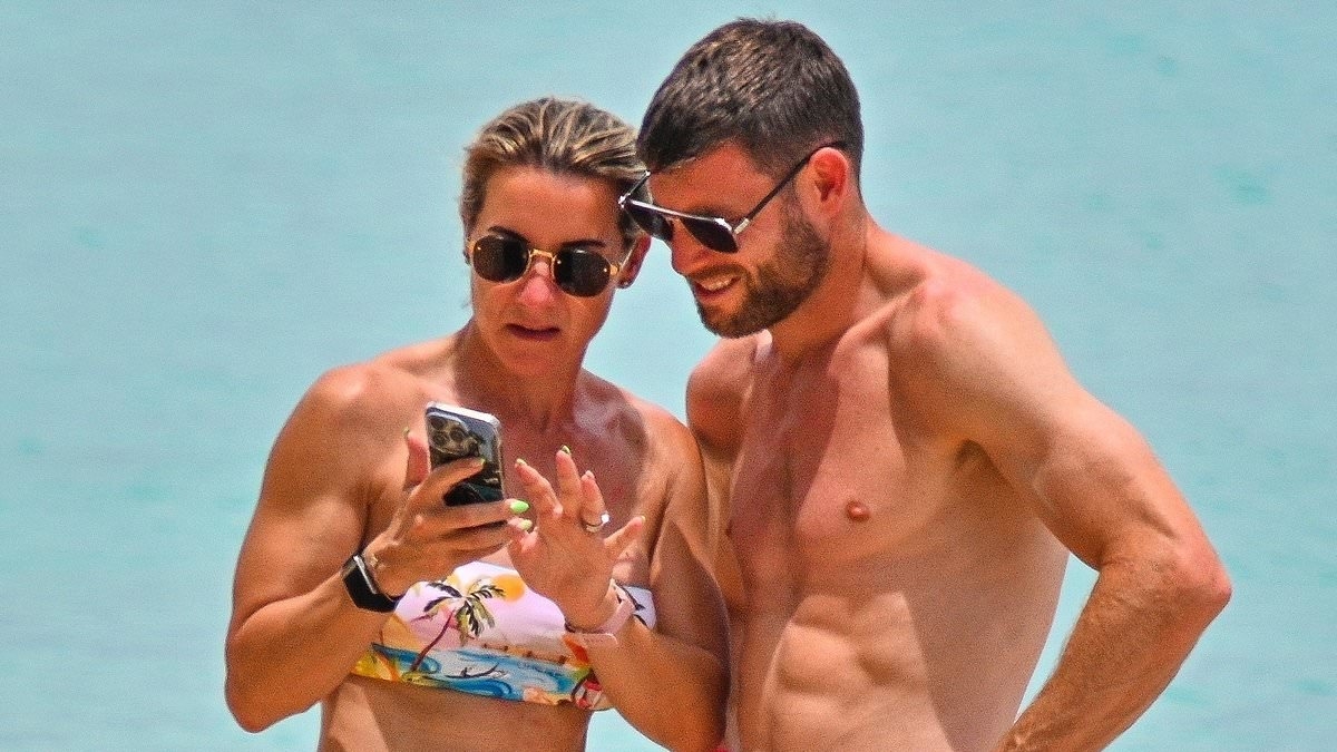 James Milner and his wife show off matching ripped physiques on beach in Barbados as Brighton midfielder, 39, targets playing into his FORTIES