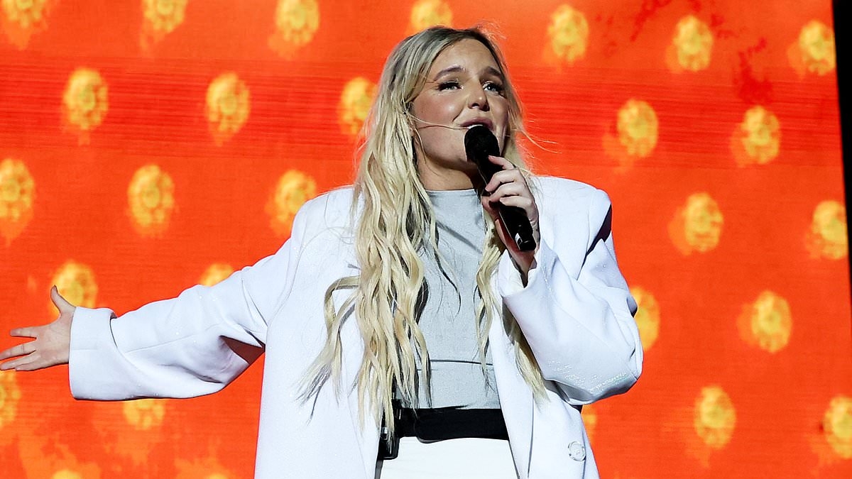 Aussie pop star Tones and I is charged over deadly dog attack - after her American bulldog escaped their $7m mansion and tore the neighbour's cavoodle to shreds