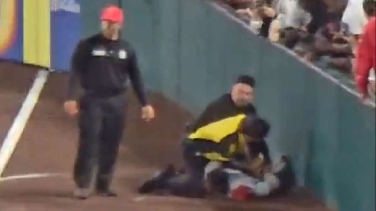 Yankees fan gets wrestled to the ground by security after sprinting around the field during Angels game