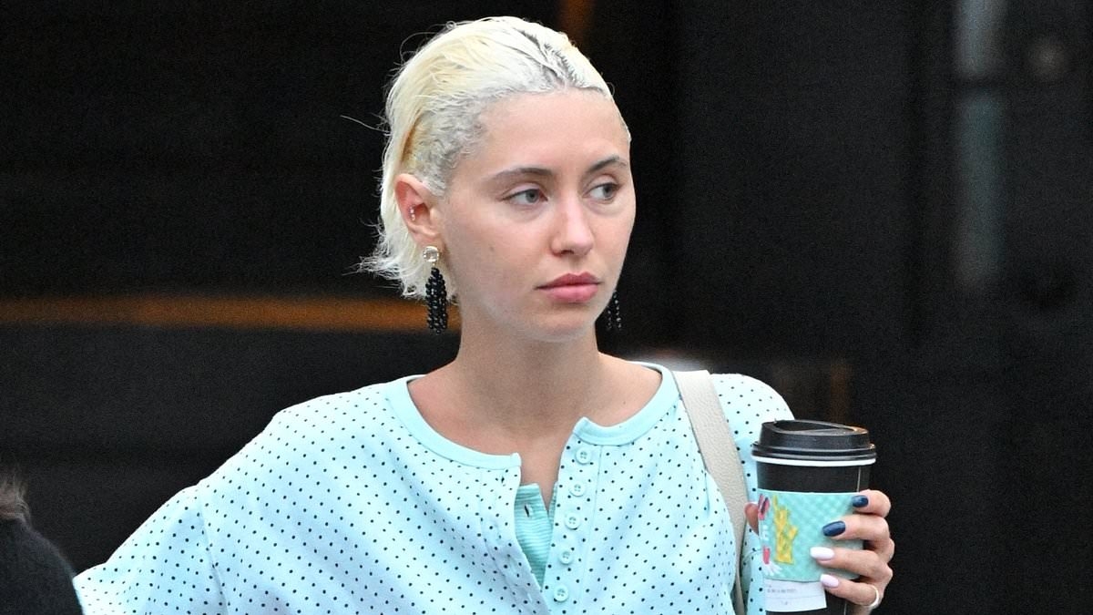 Iris Law cuts a stylish figure in a pale blue co-ord as she grabs some doughnuts in Los Angeles