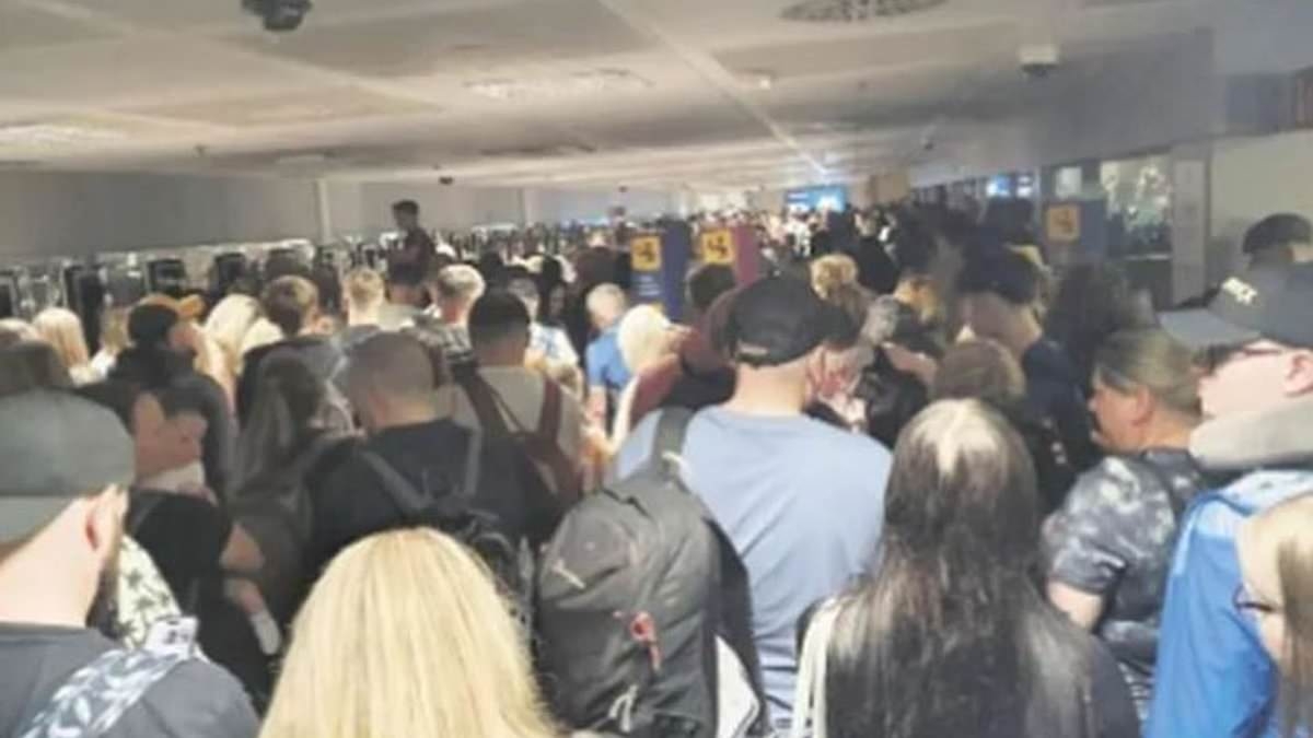 Airport chaos forces British families to 'lift children on to shoulders to stop them suffocating' amid 'inhuman' conditions as hundreds are trapped in overcrowded passport control in Tenerife