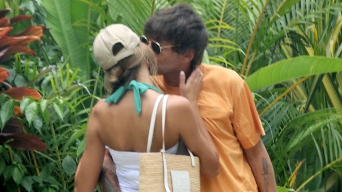 EXCLUSIVE Zara McDermott and Louis Tomlinson can't keep their hands off each other as he cheekily grabs her bottom during romantic getaway to sun-soaked Costa Rica