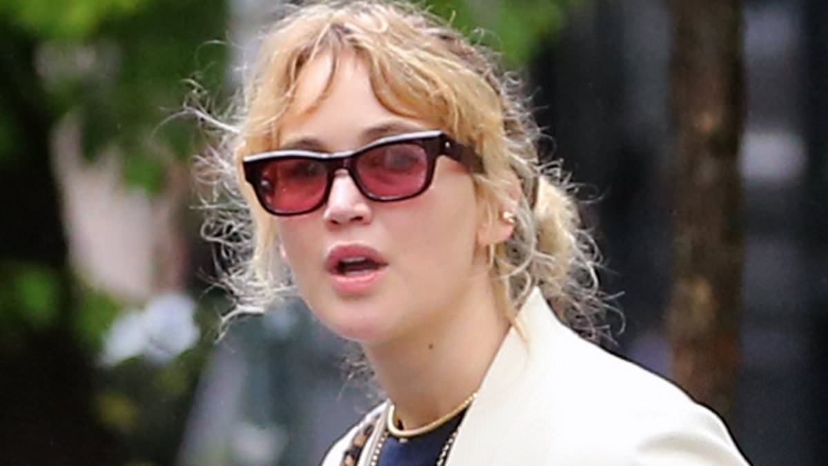 Jennifer Lawrence looks like she has stepped out of her bathroom as she wears SLIPPERS and a robe coat in NYC