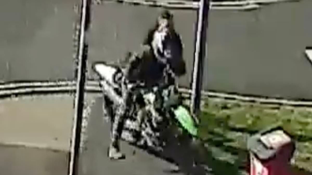 Shocking moment biker, 21, drags brave police officer across road as he tries to arrest him over dangerous town centre wheelies