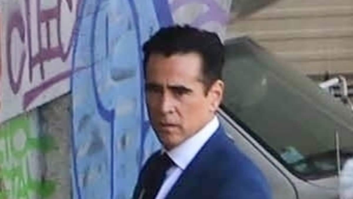 Colin Farrell looks smart in a navy blue suit as he films for season two of Apple TV series Sugar in Los Angeles