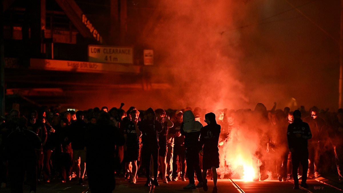 Melbourne descends into chaos as thousands of wild A-League fans set off flares and heavily armed police are called in