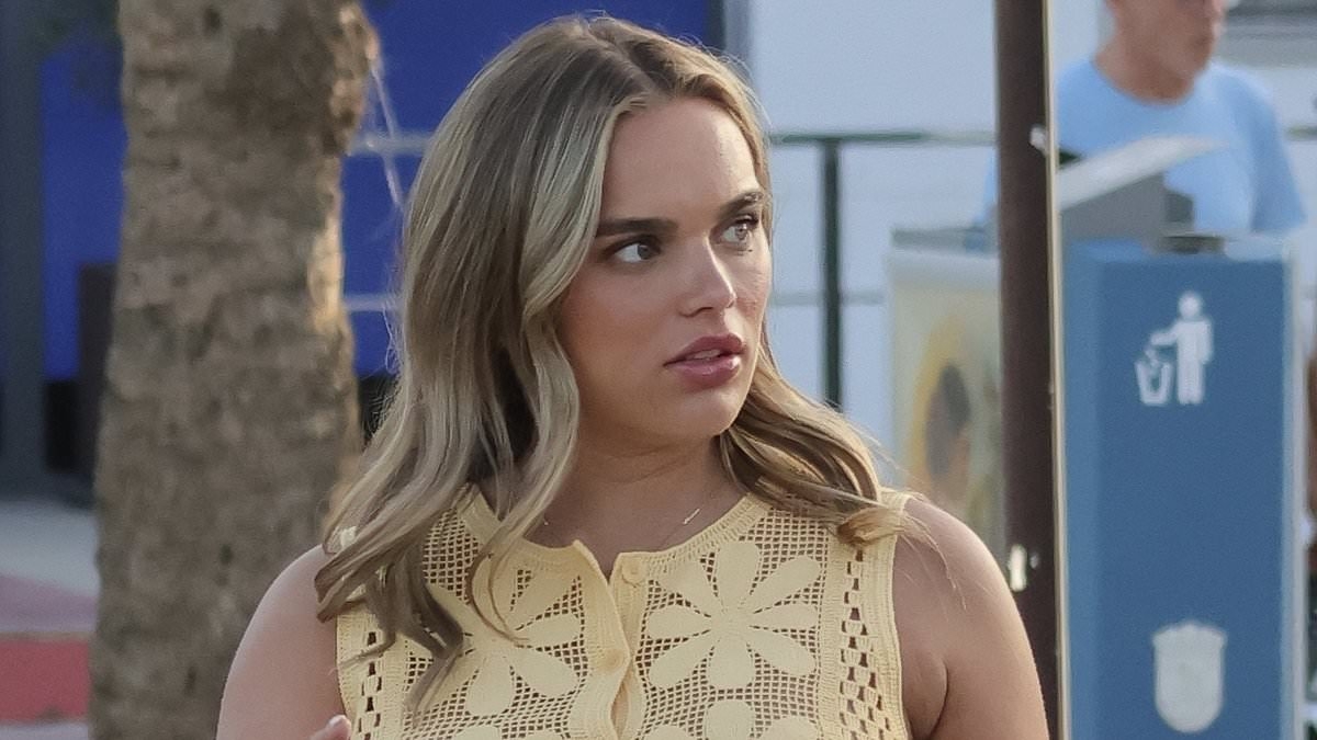 Premier League star Morgan Gibbs-White's girlfriend Britney De Villiers displays her growing baby bump in a yellow co-ord during Spanish getaway