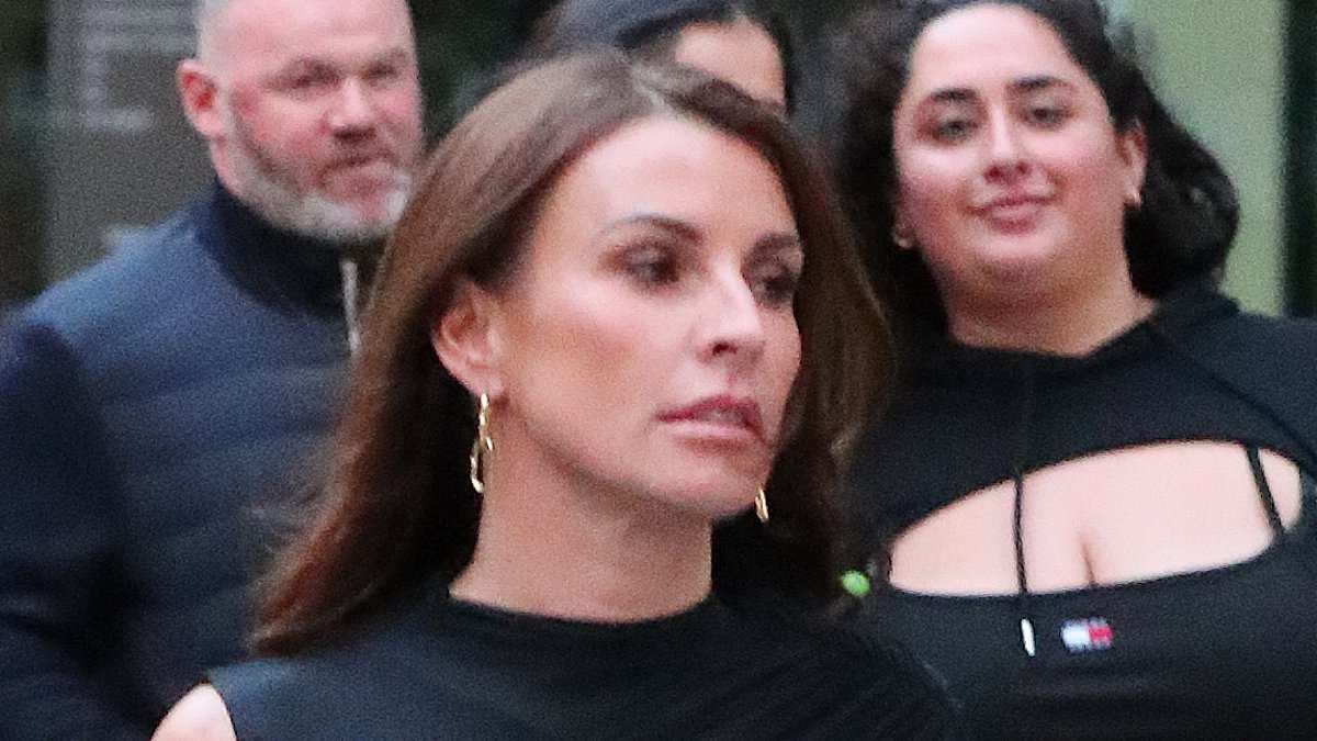 Coleen Rooney cuts a glamorous figure in a leggy black dress as she enjoys a night out in Manchester with husband Wayne