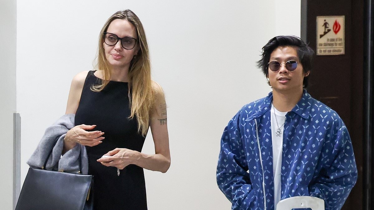 EXCLUSIVE Fears for 'troubled' child of Angelina Jolie and Brad Pitt pictured unable to stand on wild night out... weeks after near-death accident