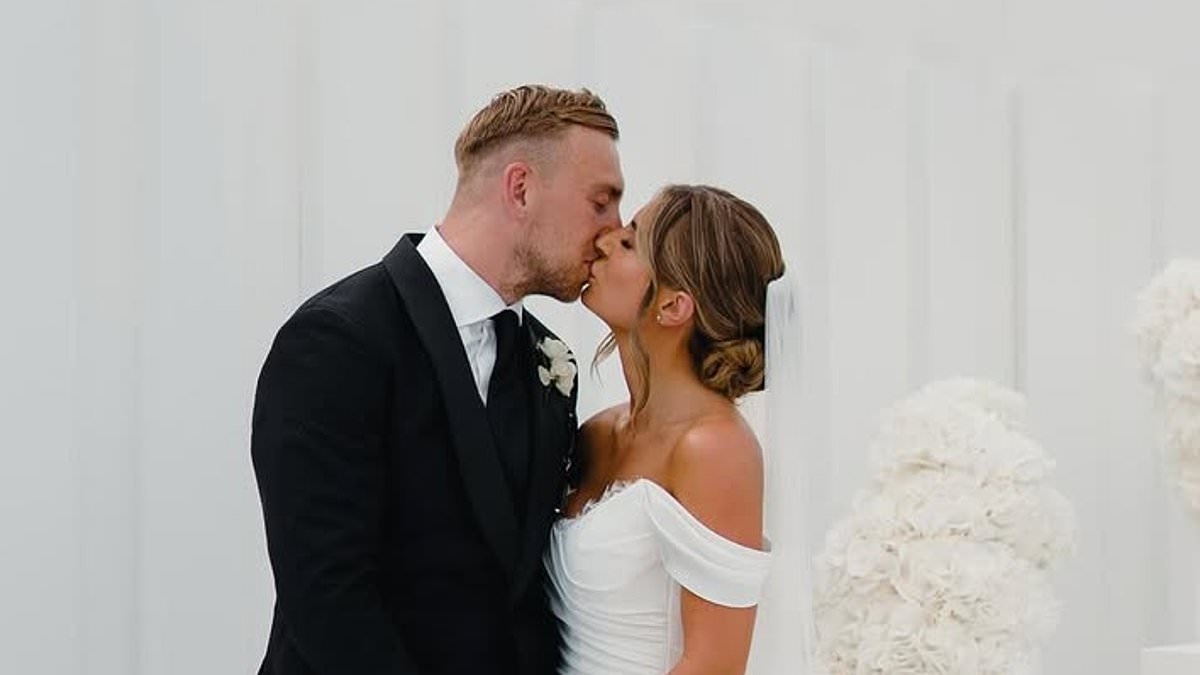Moment Dani Dyer shared a passionate kiss with new husband Jared Bowen after saying 'I do' in unseen snap from their wedding day