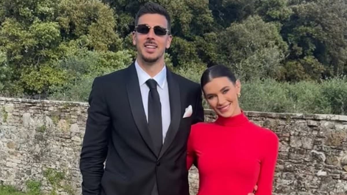 Would you wear this to a wedding? Brittany Hockley steals the spotlight and risks a wardrobe malfunction in a daring red dress slit to the crotch at friend's nuptials in Italy