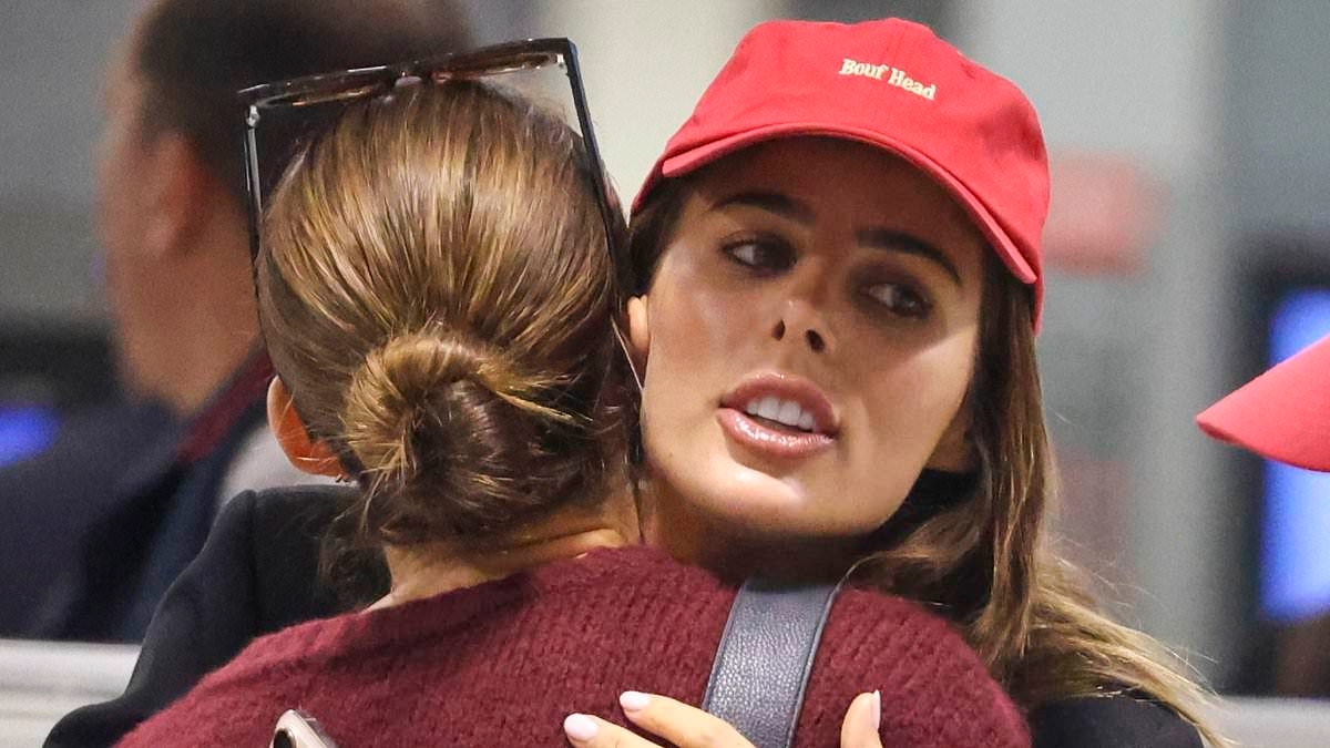 Indy Clinton reveals her uneven nostrils after undergoing rhinoplasty as she almost suffers a wardrobe malfunction at the airport following girls weekend away