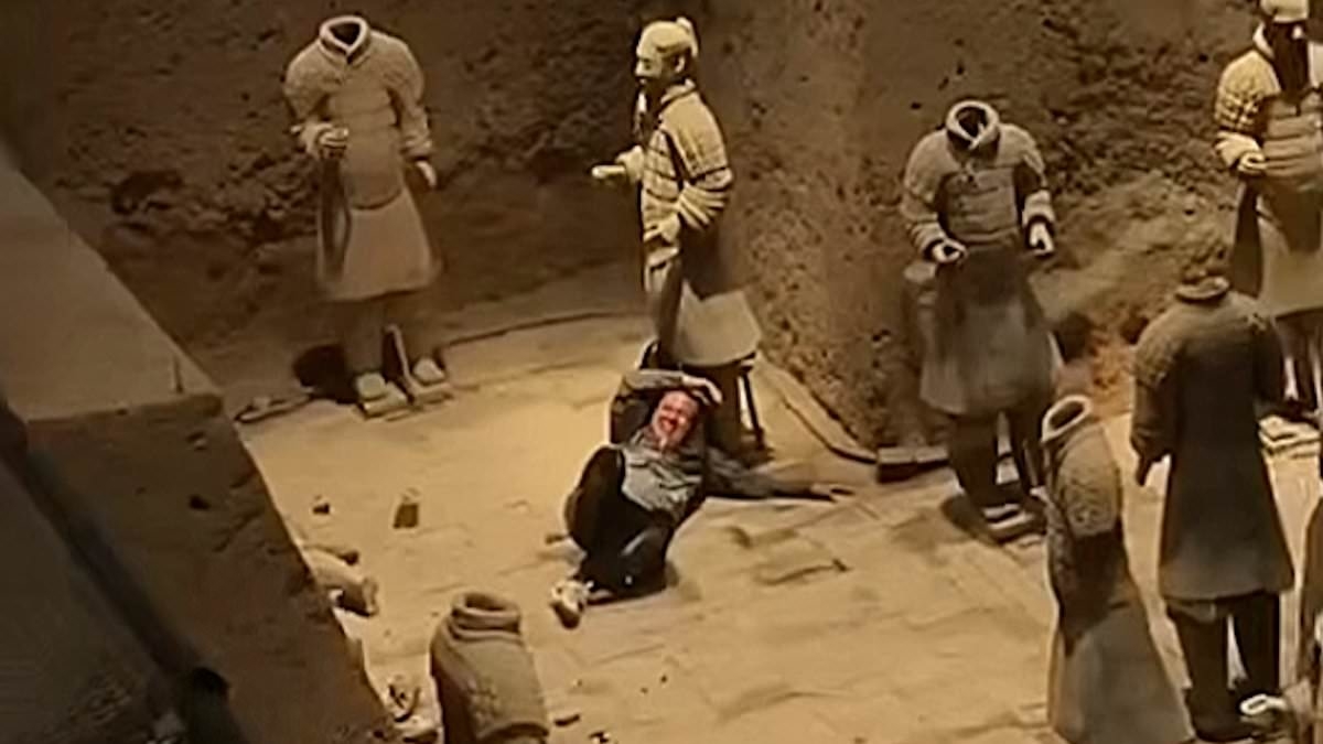 Shocking moment tourist jumps into Terracotta Army clay warriors and damages statues before being overpowered by security guards