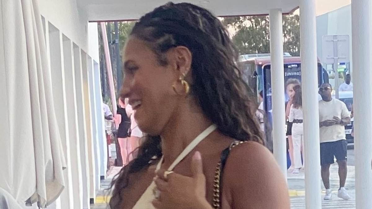 Pregnant Vick Hope shows off her baby bump in a white crochet mini dress as she arrives to watch husband Calvin Harris' DJ set in Ibiza ahead of welcoming their first child