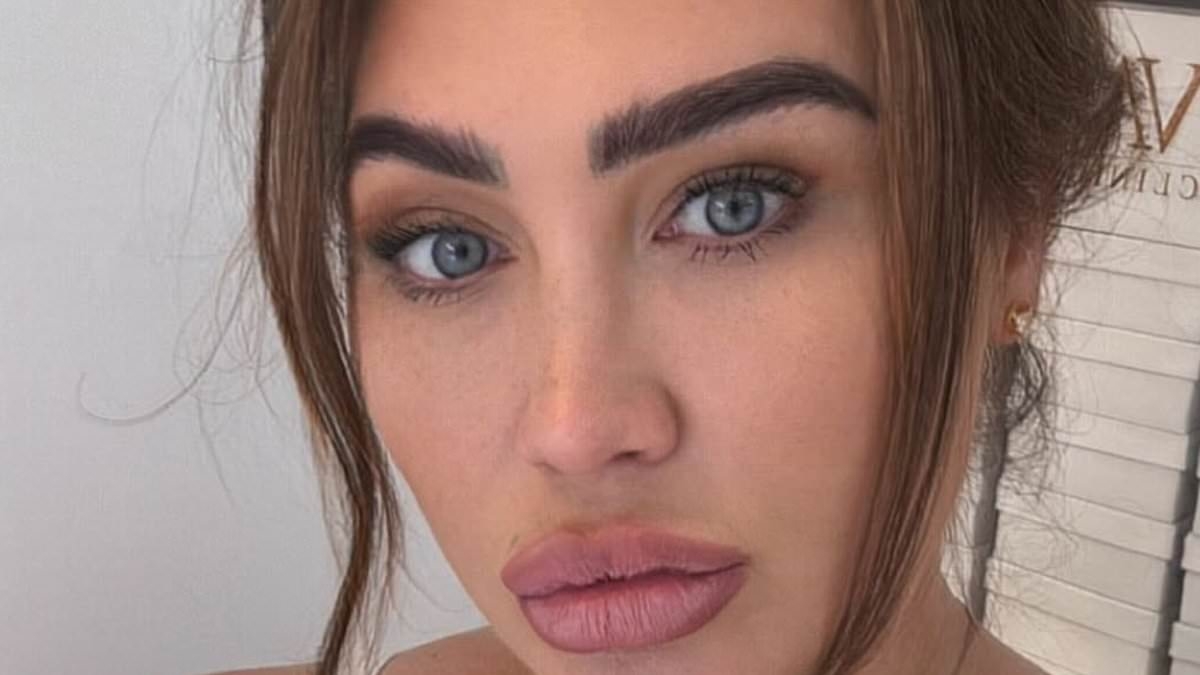 Lauren Goodger puts on a VERY busty display as she poses in a plunging strappy top - after vowing to get her 'bikini body' back