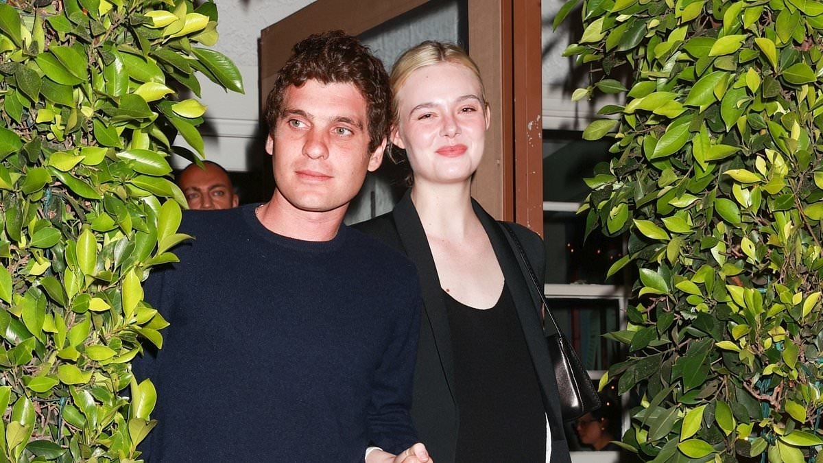 Elle Fanning's older boyfriend Gus Wenner puts his arm around her after a romantic Italian dinner by the beach