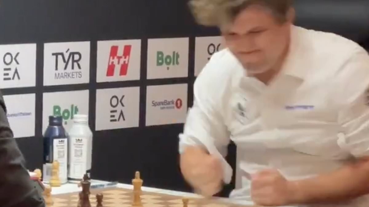 Moment 'world's greatest' chess player loses his composure and slams his fist into the table after losing game