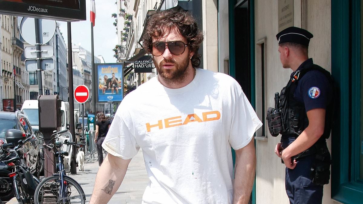 Aaron Taylor-Johnson enjoys a sunny stroll in Paris amid mounting speculation he'll be chosen as the next James Bond