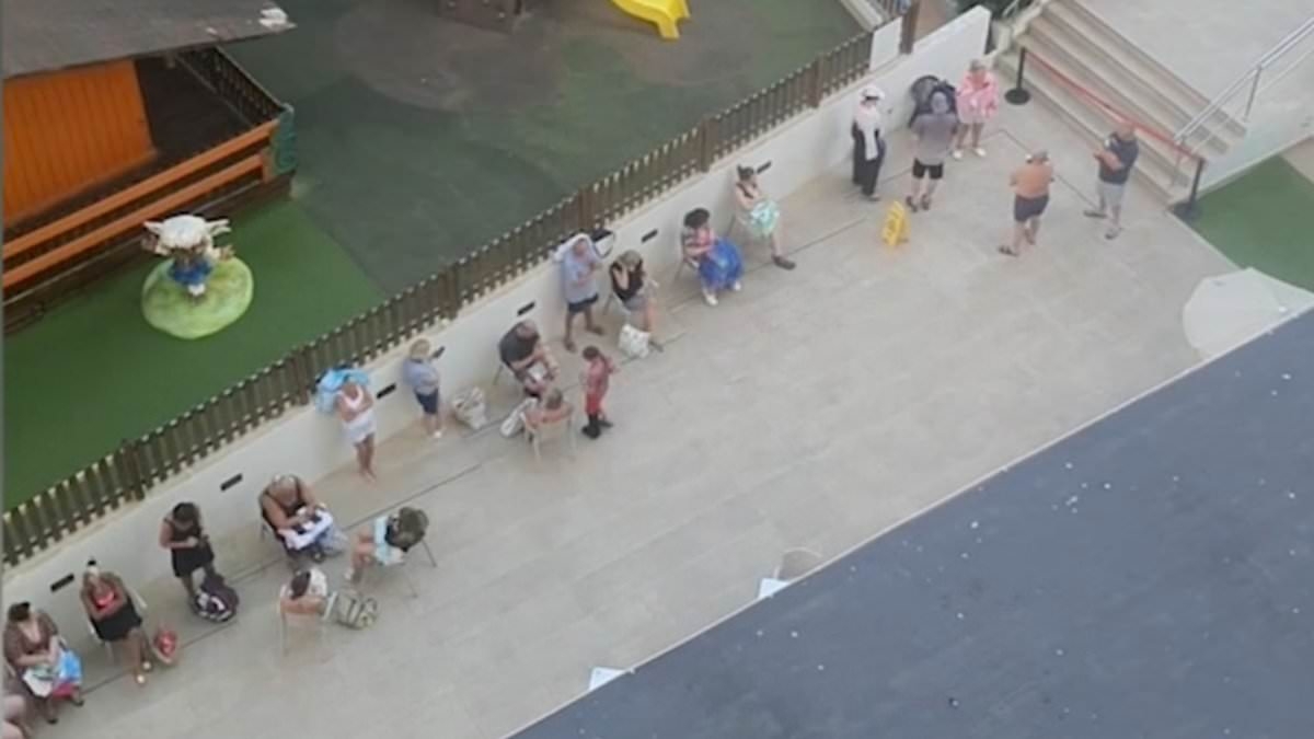 Sunbed wars: Dozens of Benidorm holidaymakers queue early to nab poolside loungers