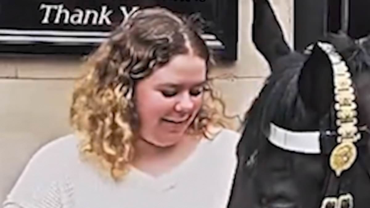 Neigh-ver letting go! King's Guard horse bites tourist's arm after she stands too close