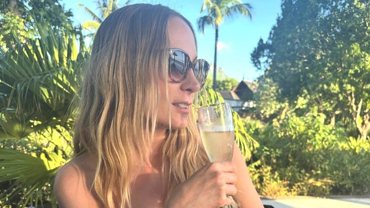 Downton Abbey star Joanne Froggatt flaunts her toned figure in bandeau bikini as she relaxes with a glass of fizz on sunny getaway to Mauritius
