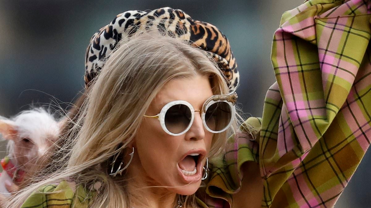 Fergie, 50, puts on an animated display in a yellow plaid co-ord and white crop top as she re-shoots hit 2006 music video for new Netflix series