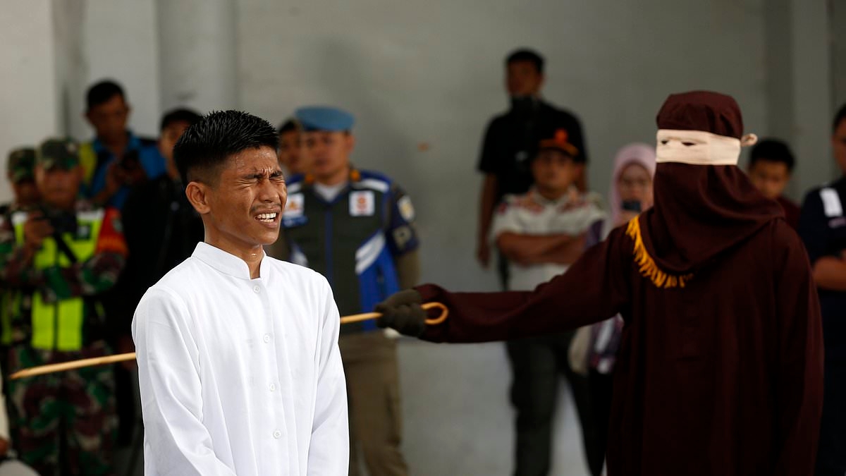 100 lashes each for unmarried sex: Couple are flogged in front of a crowd as part of Sharia law punishment in Indonesia