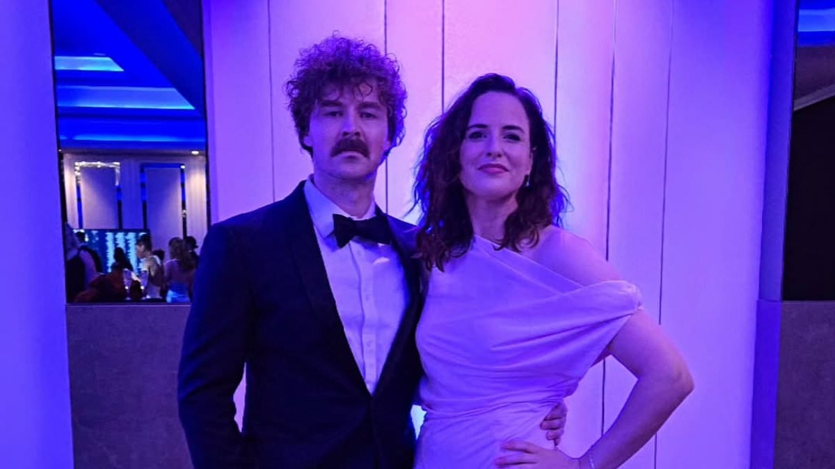 Aussie Olympic cult hero Raygun dazzles as she makes surprise appearance at glamorous sports ball