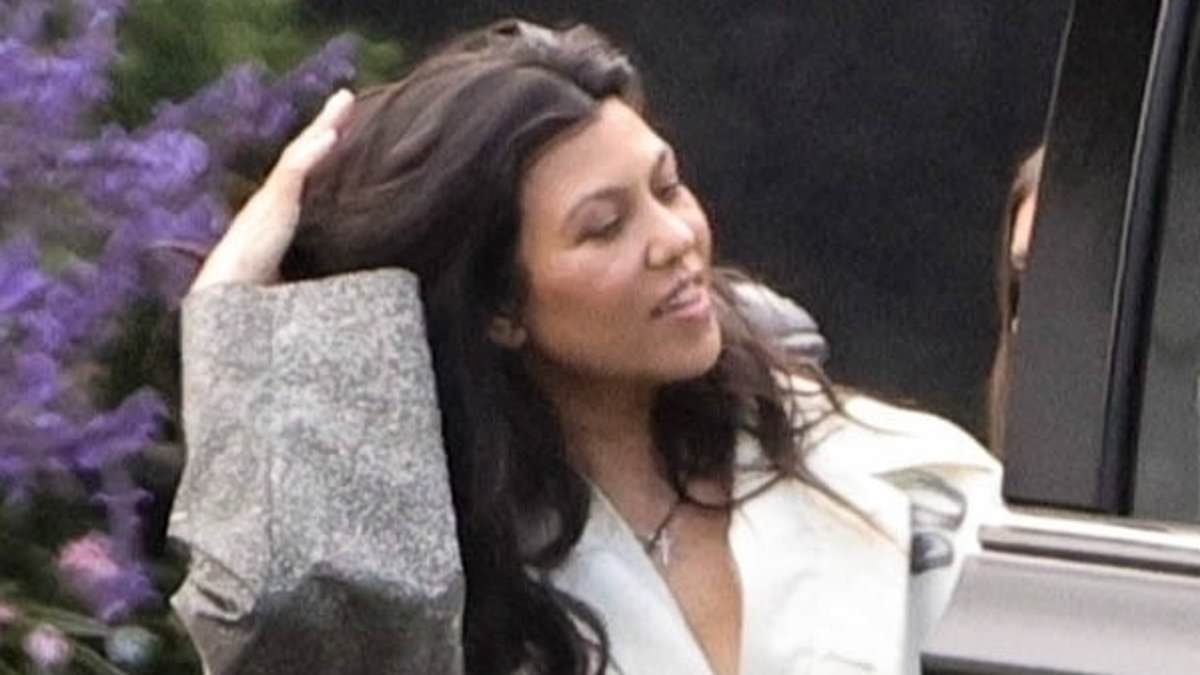 Kourtney Kardashian wears a ROBE to fancy restaurant as mini-me daughter Penelope, 12, is almost her height