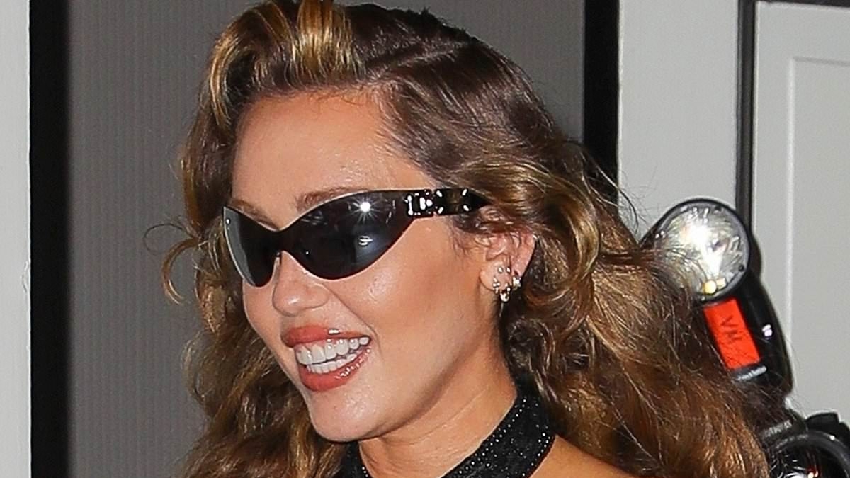 Miley Cyrus flashes sideboob in tiny halter top as she steps out in NYC with much-younger boyfriend