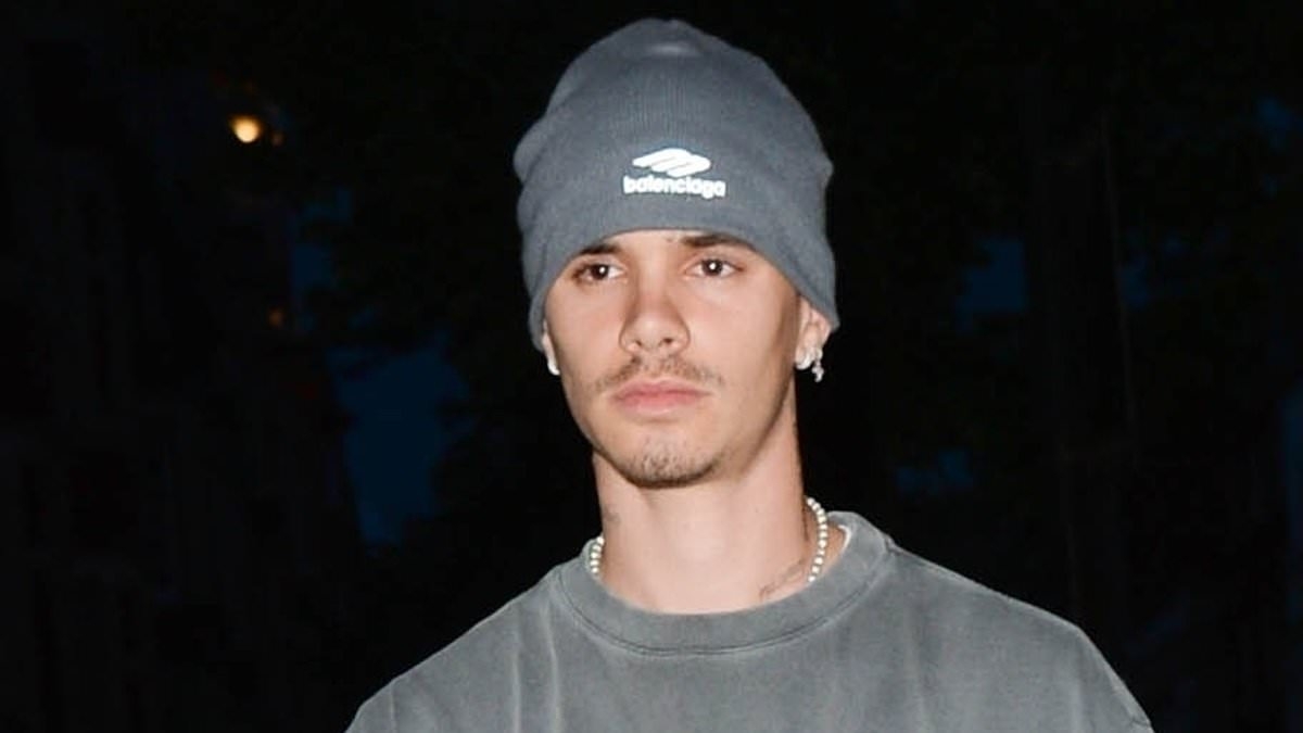 Romeo Beckham cuts a sombre appearance as he heads home from night out in London following split from Kim Turnbull after seven months