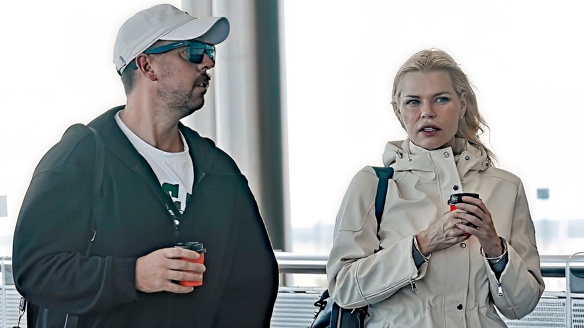 She's just like us! Makeup free Sophie Monk gets windswept as she catches a bus with her rarely-seen husband Joshua Gross in Brisbane