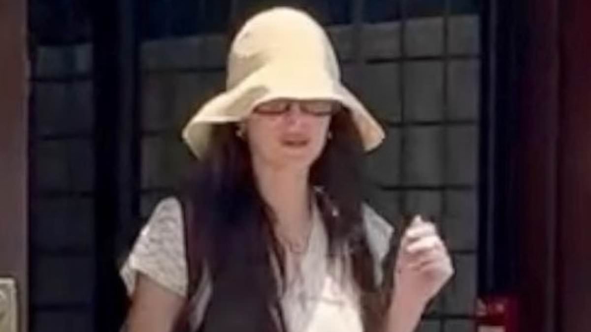 Dakota Johnson looks downcast without her engagement ring as she breaks cover amid Chris Martin split