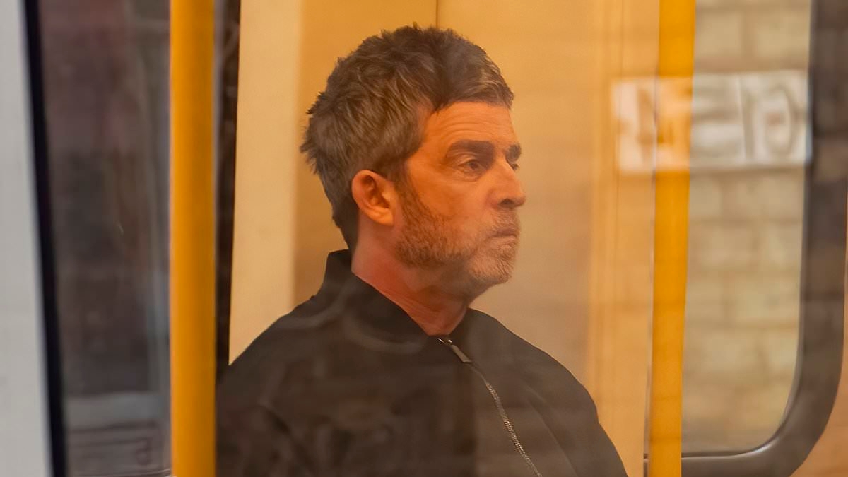 Noel Gallagher looks stony-faced on the tube as he heads to join brother Liam for Oasis rehearsals for the first time in 16 years ahead of reunion tour