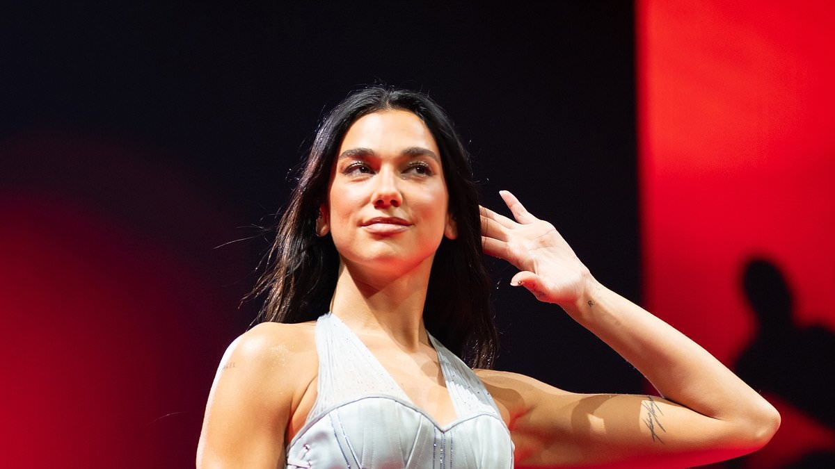 Dua Lipa shows off her incredible figure in a corseted bodysuit and sheer dress as she takes her Radical Optimism tour to Amsterdam