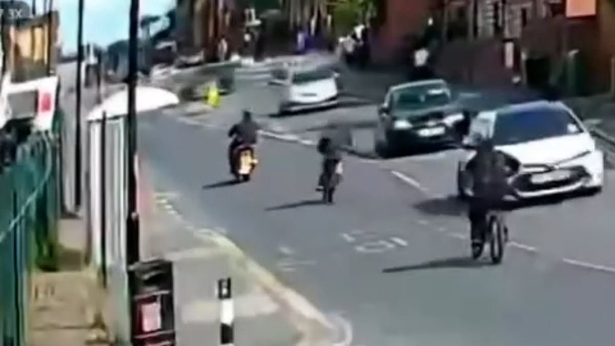 EXCLUSIVE Horrifying moment Audi appears to swerve into path of e-bikes in sickening crash that killed teenage pedestrian and left rider, 18, fighting for his life in hospital
