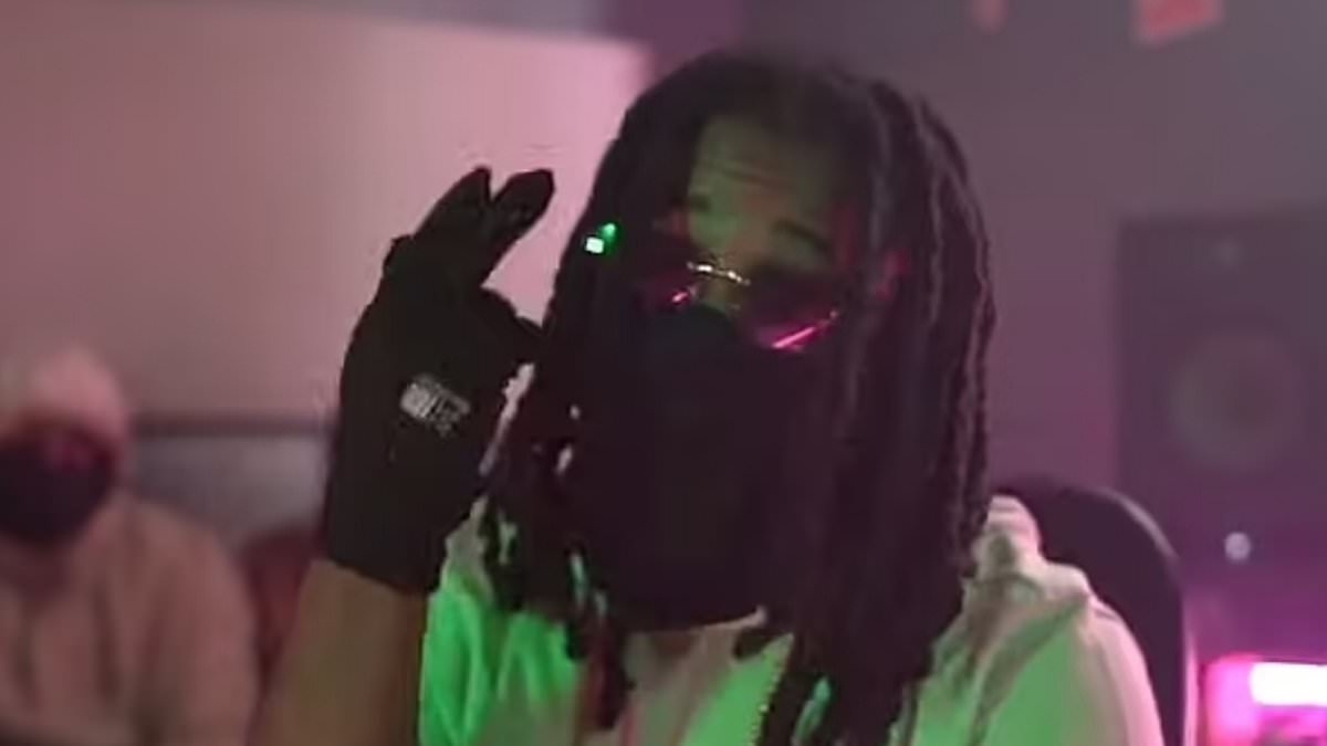 Moment rapper threatens murder victim on YouTube - before knifing him in the neck in front of his horrified son