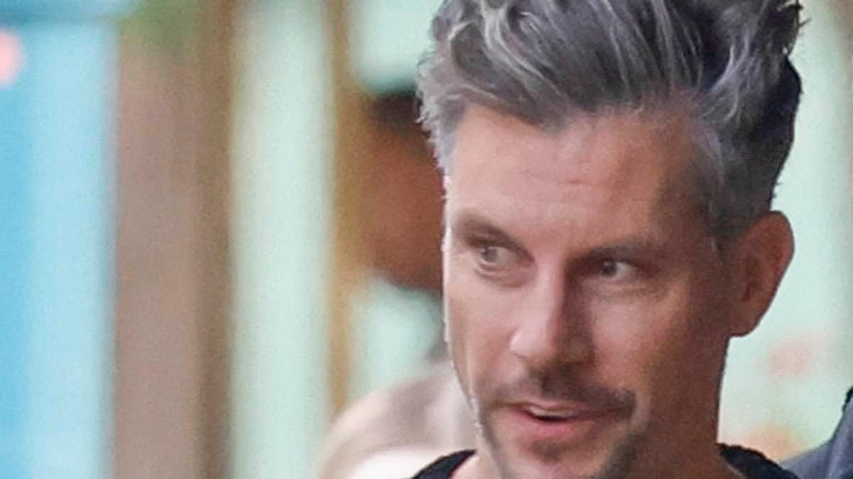 Daddy duty! The Bachelor's Sam Wood is every inch the doting father as he juggles his three young daughters during an outing in Melbourne