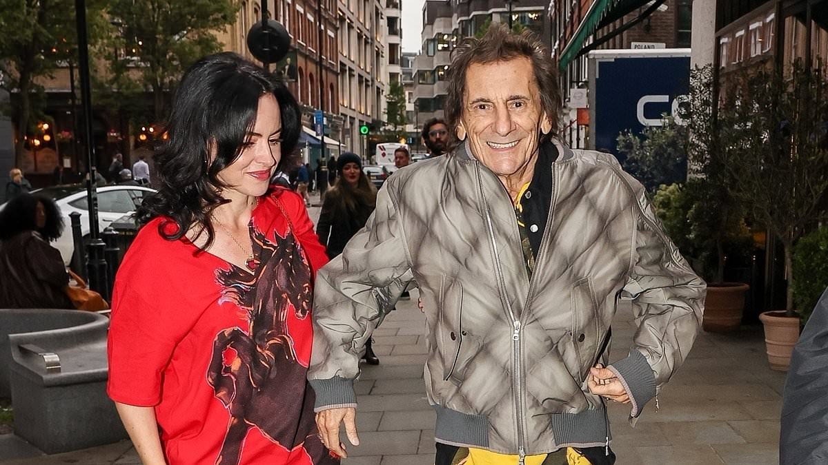 Ronnie Wood, 78, rocks a pair of custom-made Rolling Stones trainers as he steps out with wife Sally, 47, for an event celebrating 50 years of the iconic band