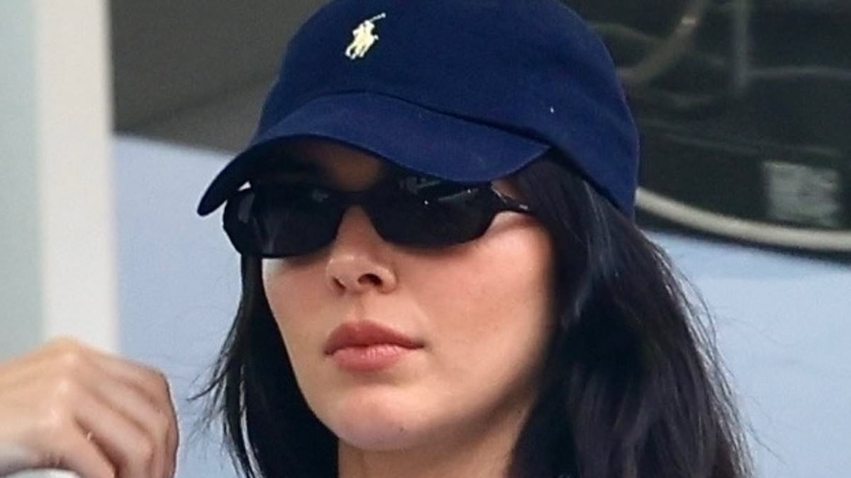 Kendall Jenner cuts a chic off-duty model look in denim and striped shirt as she treats herself to a solo sushi dinner in West Hollywood