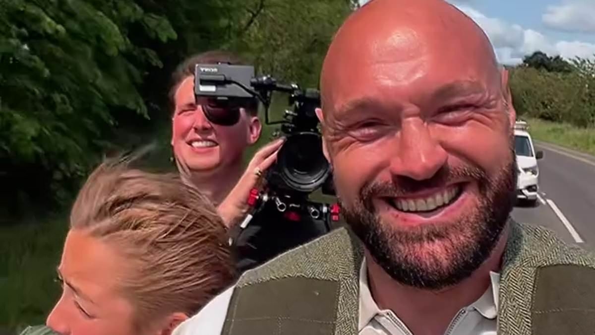 Tyson Fury horses around with his family as he takes delivery of traditional gypsy caravan - while thousands of travellers arrive at Appleby Horse Fair