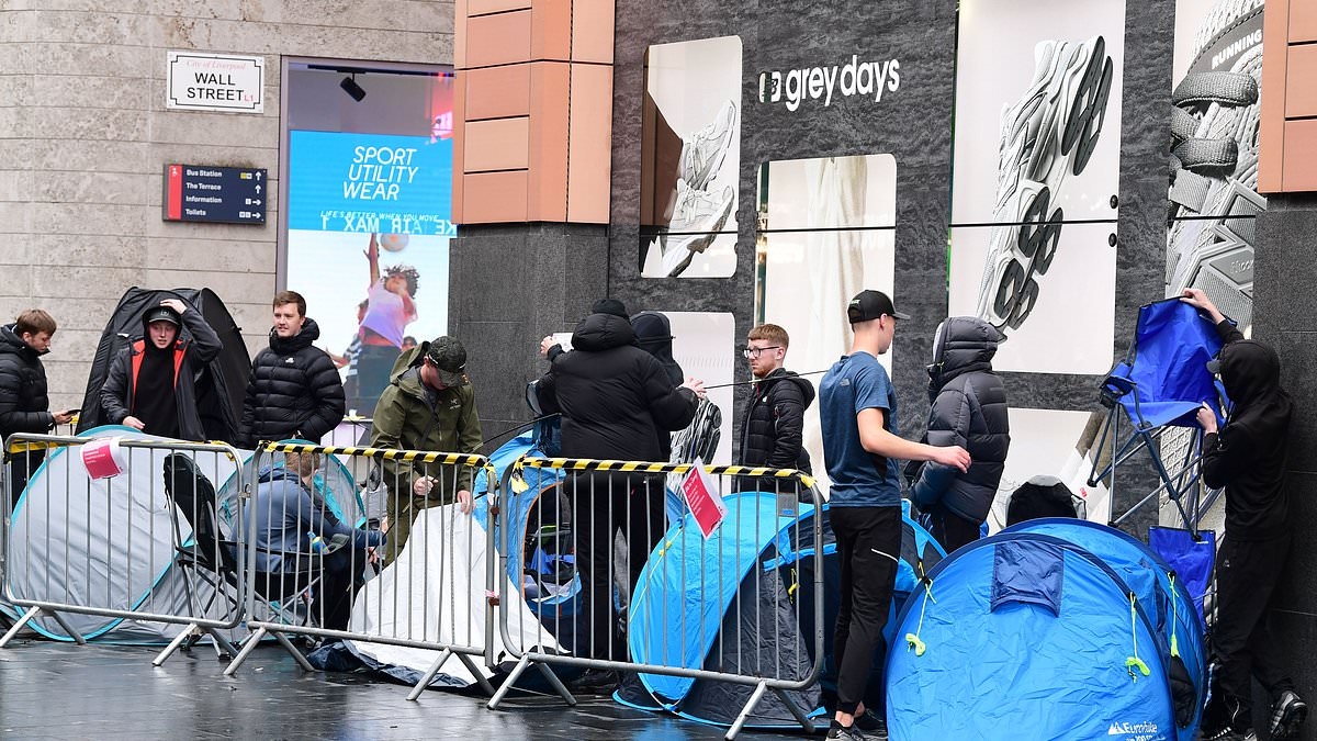 Teenagers camp out overnight and brave '15 hour' queues in the pouring rain to get their hands on brand new Nike trainers