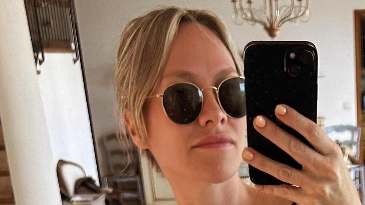 Chloe Madeley showcases her washboard abs in a black bikini as she enjoys a family holiday in France