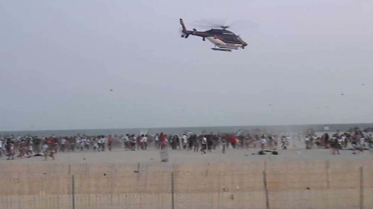 Shocking moment mass brawl breaks out between huge group of high schoolers on popular New York vacation beach