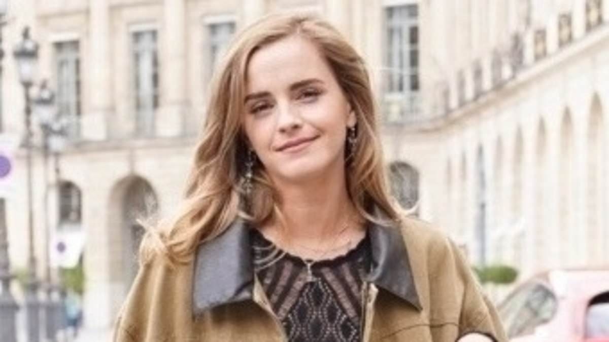 Emma Watson looks effortlessly chic in a black mesh top and light-blue denim jeans as she steps out in Paris