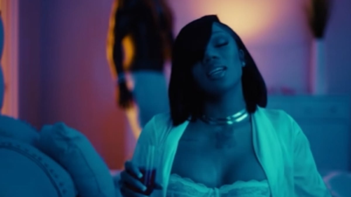NFL player and rapper spark dating rumors by starring in racy music video