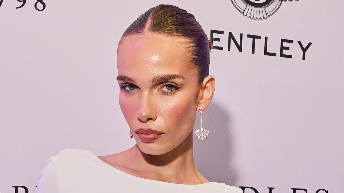 Hana Cross is the epitome of chic in a white figure-hugging gown as she attends the Boodles Boxing Ball - amid ex Brooklyn Beckham's ongoing family feud